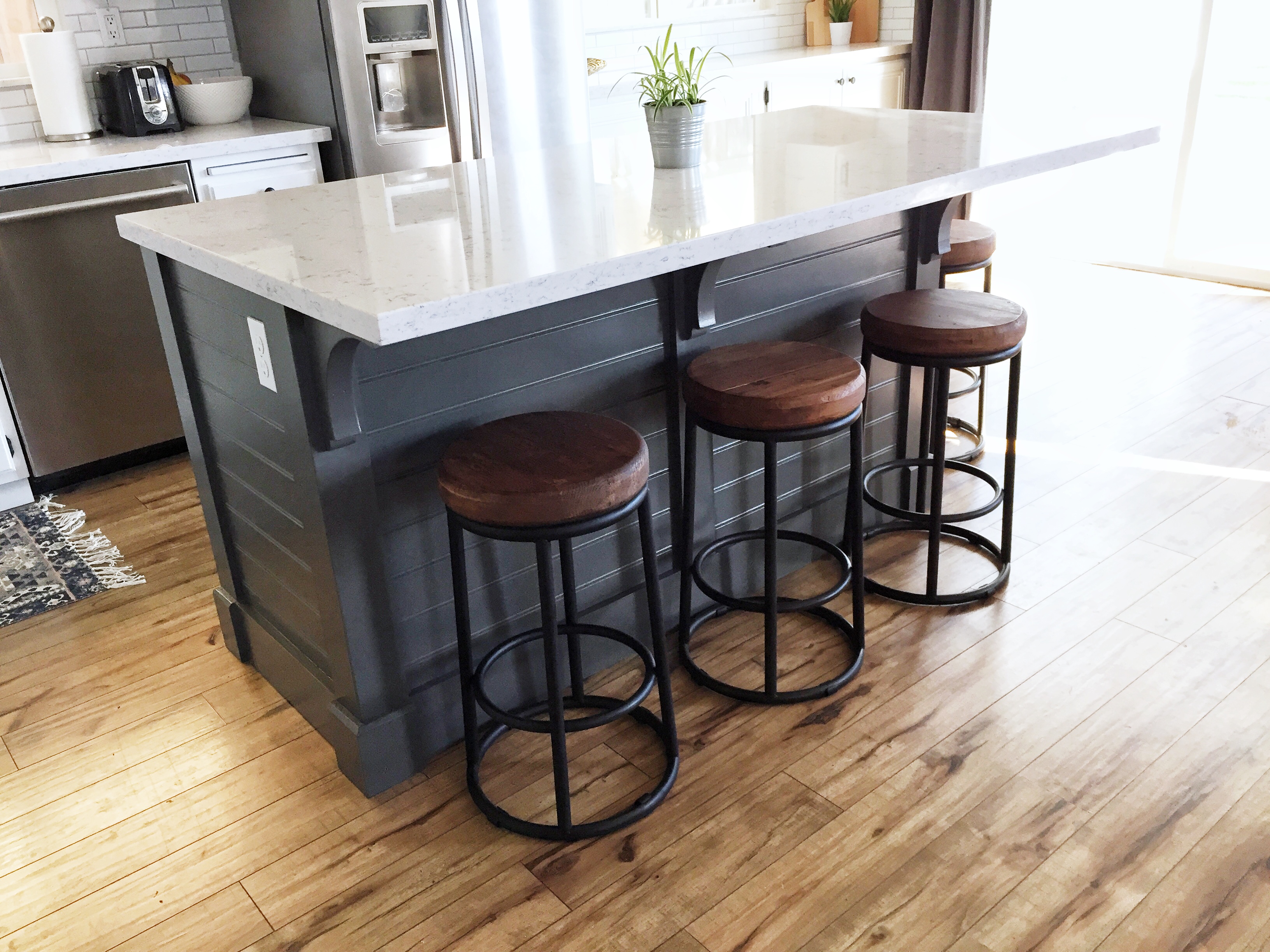 large kitchen island with bar stools