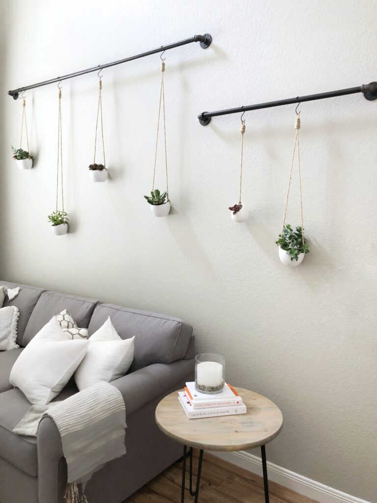 A tutorial for hanging succulents on any wall, featured by top DIY blog, Domestic Blonde