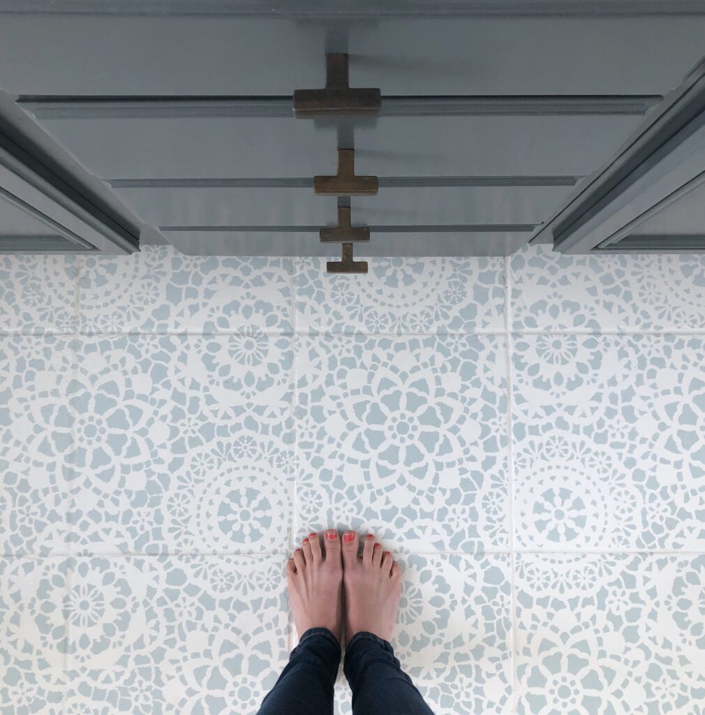 Stencil tile floor update featured by top US DIY blog, Domestic Blonde