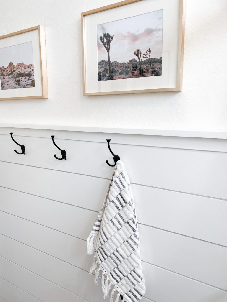 Small Bathroom Remodel Ideas with before and after pictures featured by top US DIY blog, Domestic Blonde: shiplap wall and art in bathroom