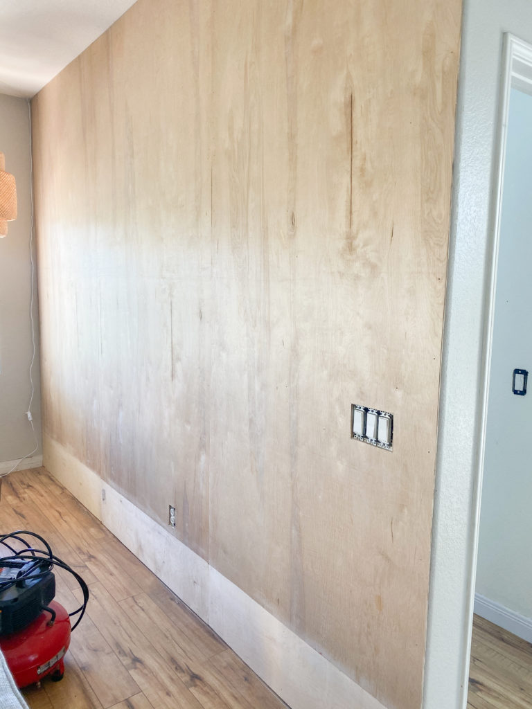 Board and Batten Wall by popular San Diego DIY blog, Domestic Blonde: image of some plywood boards mounted on a wall. 