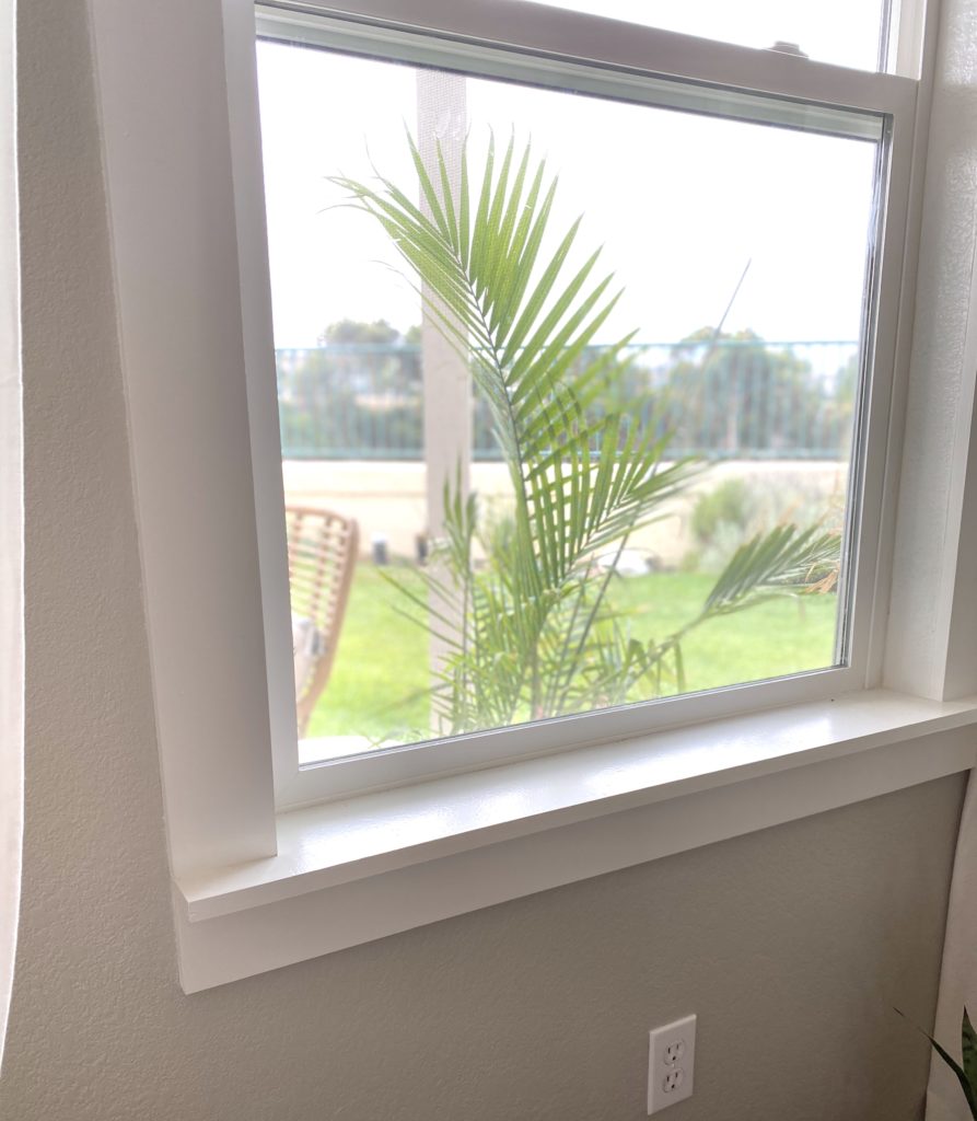 DIY Window Frame by popular San Diego DIY blog, Domestic Blonde: image of framed window in a living room. 