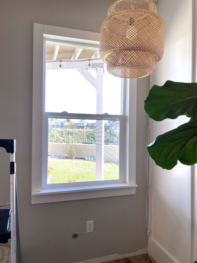 DIY Window Frame by popular San Diego DIY blog, Domestic Blonde: image of framed window in a living room. 