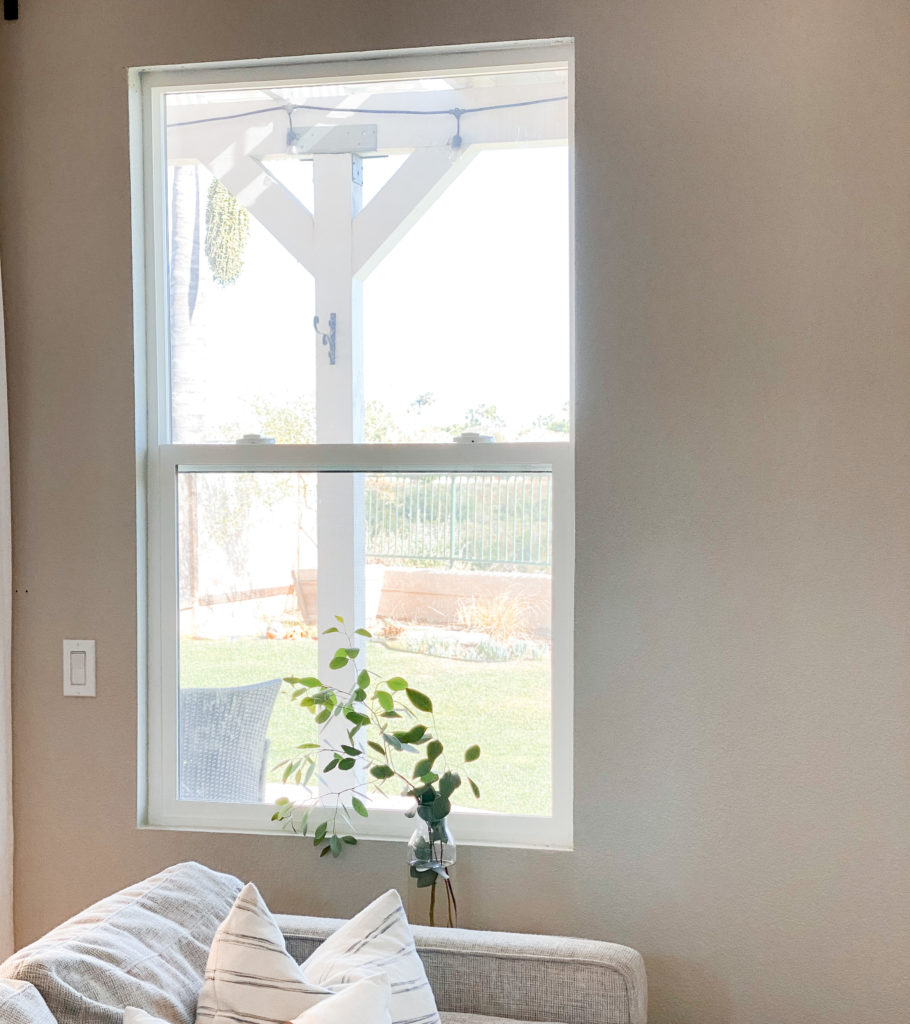 DIY Window Frame by popular San Diego DIY blog, Domestic Blonde: image of a window in a living room. 